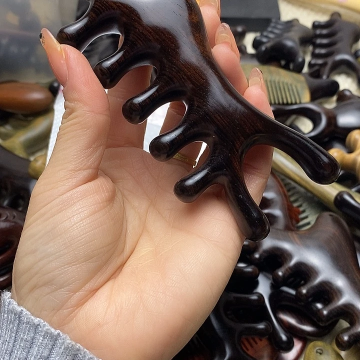 紫光檀大白鲟按摩梳多用