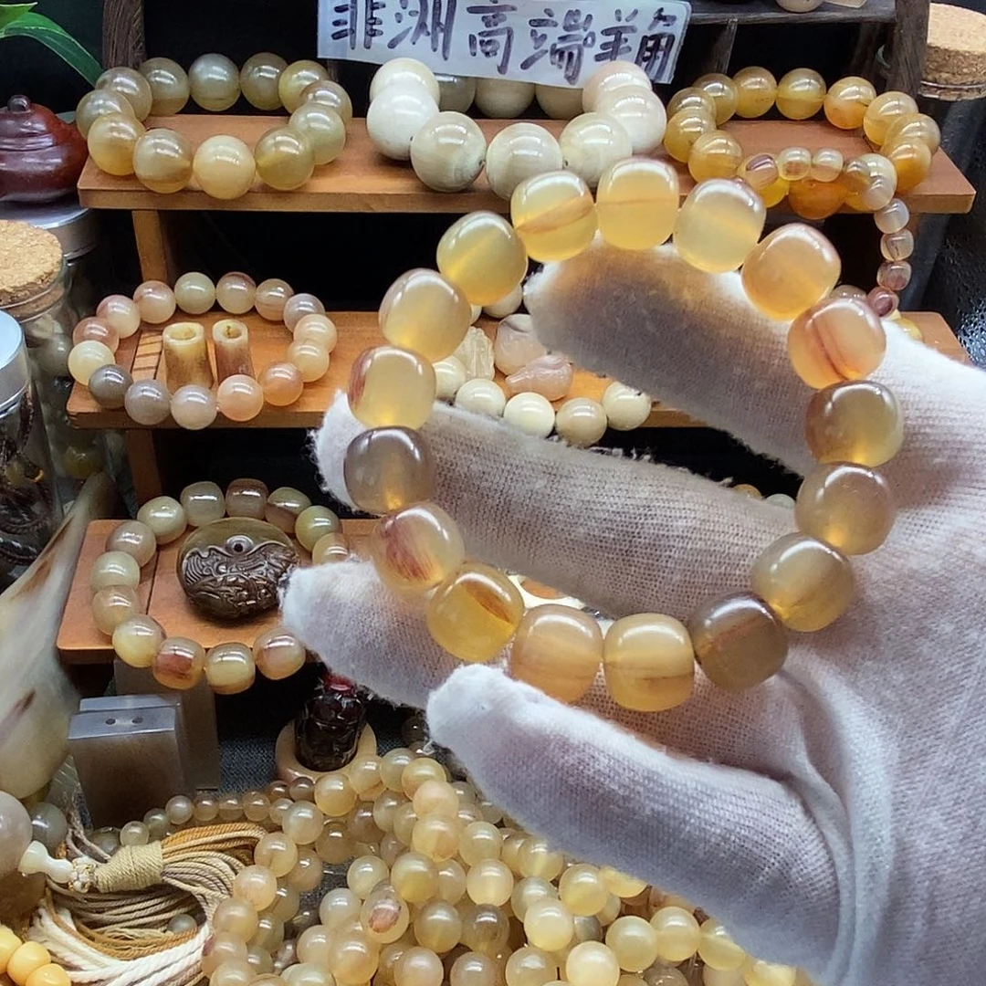 一***人非金属12x11mm老型珠非洲黑斑羊角手串