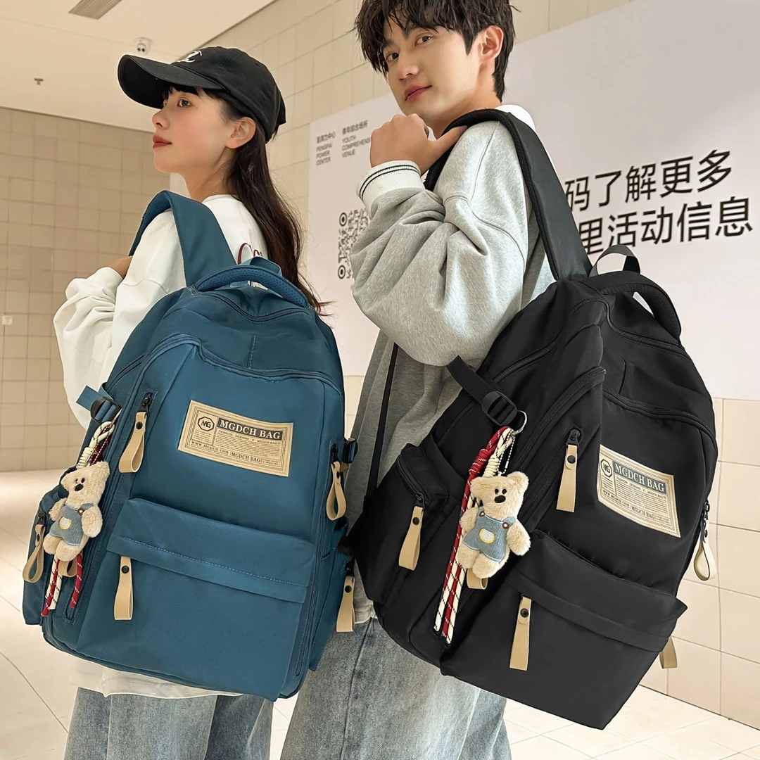 减负护脊大容量男士高中学生书包初中女生大学生户外旅行双肩背包
