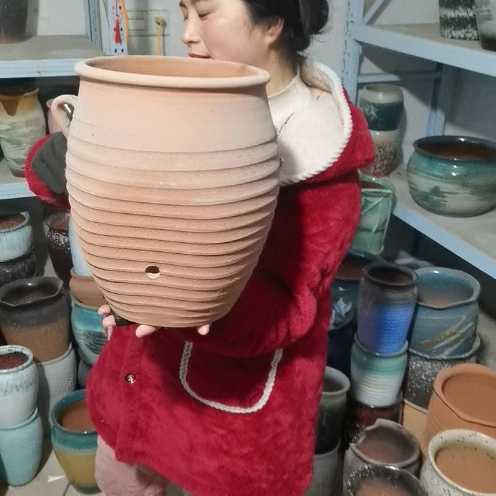 红陶口22高30瑕疵掉耳朵