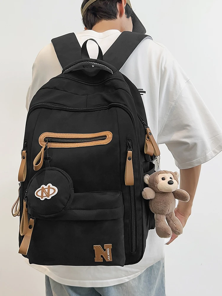 减负护脊拉链潮流高中生超轻防水书包双肩护脊大学生简约轻便百搭