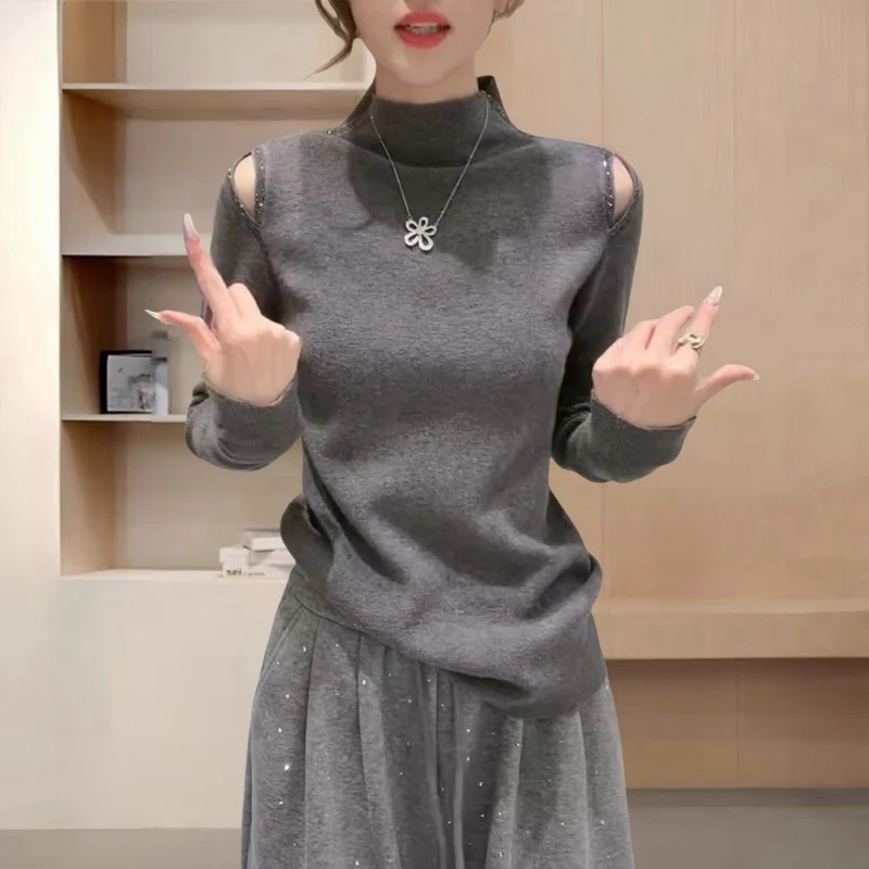 设计感肩膀镂空半高领针织打底衫女秋冬新款修身显瘦内搭长袖上衣