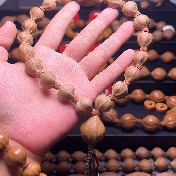 乐***呵橄榄核手串蜜桃 手持 15