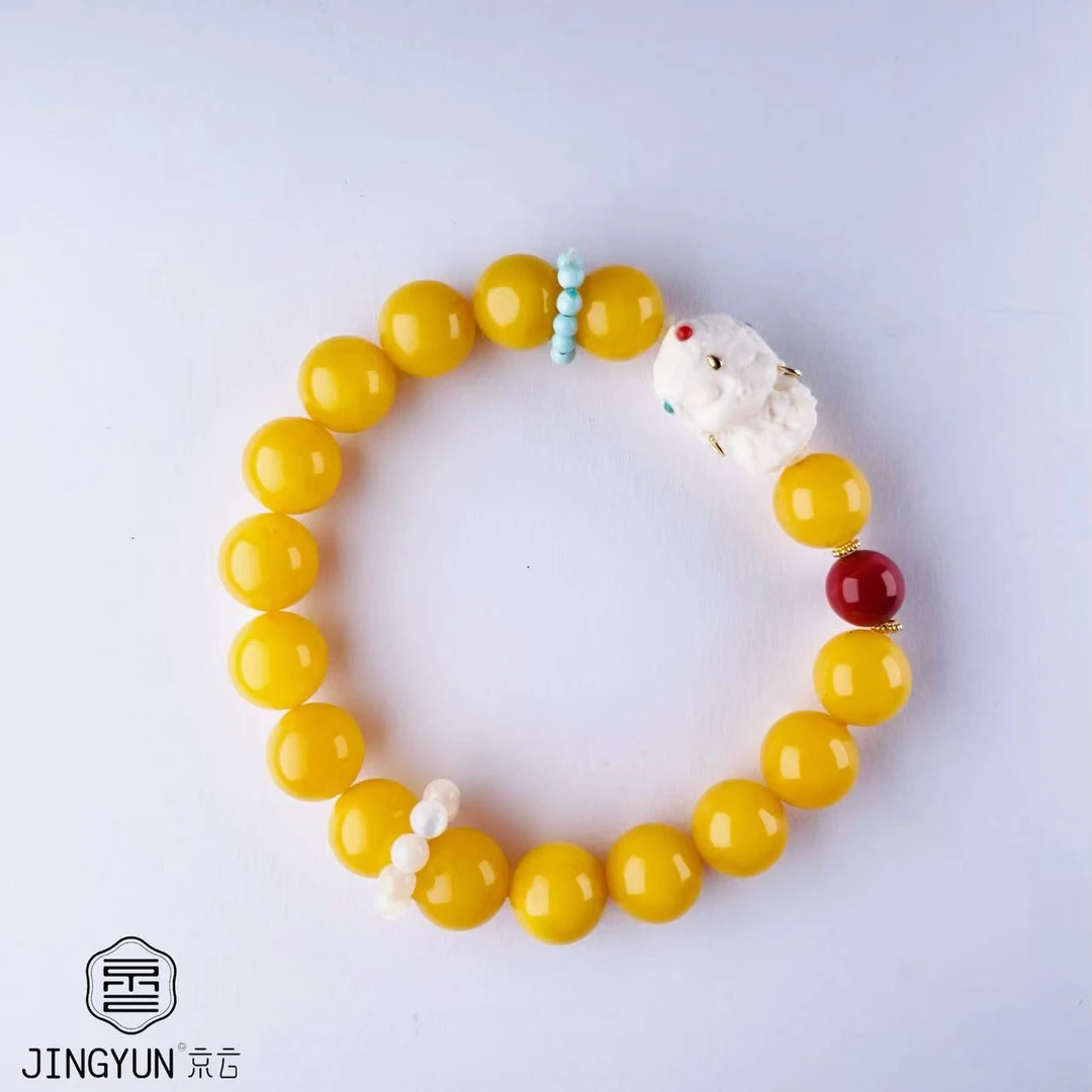 蜜蜡猛犸扎基拉姆手串9mm鸡油黄