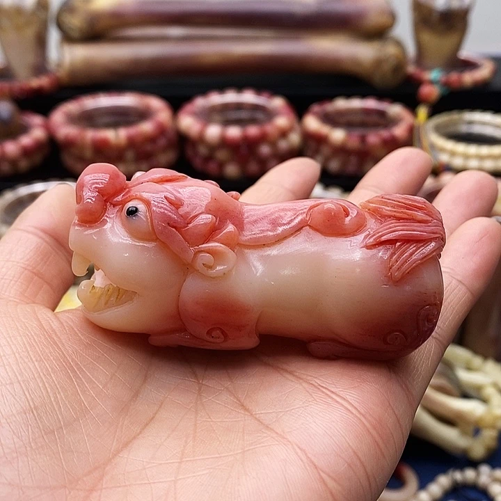 其他驼骨半血手把件