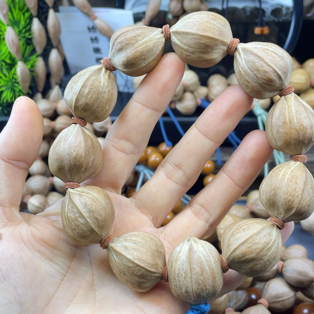 $***$橄榄核吊坠 24x28铁核四花