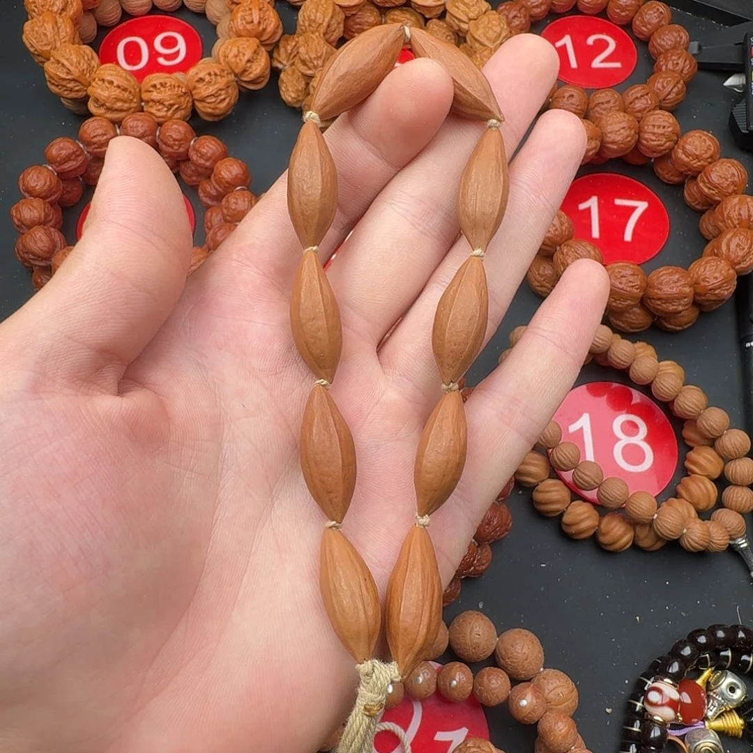 半***决文玩核桃吊坠橄榄核