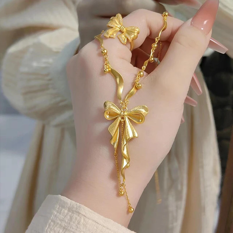铜合金项链 项链金色蝴蝶结女爱心流苏一体锁骨链新款轻奢风小众