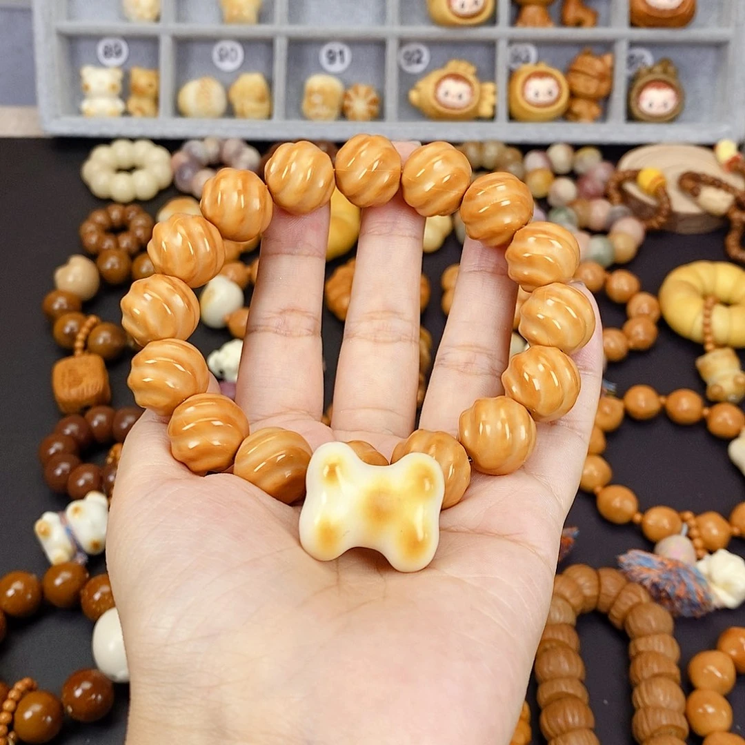 徐***徐吊坠菩提根/象牙果扭扭猴头骨头猫爪