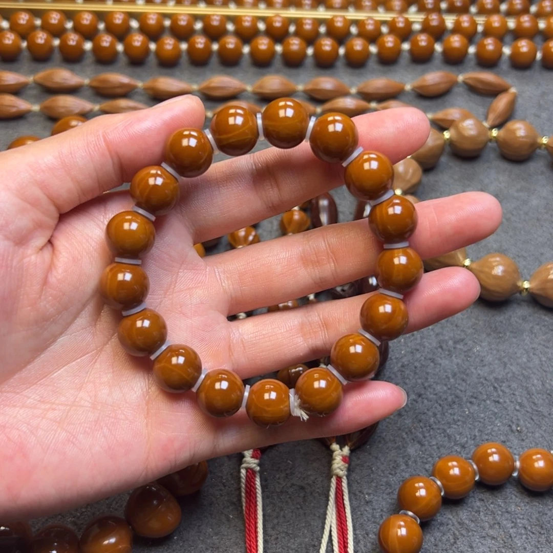 舒***飞橄榄核手串/手链1.2➕正圆 铁核