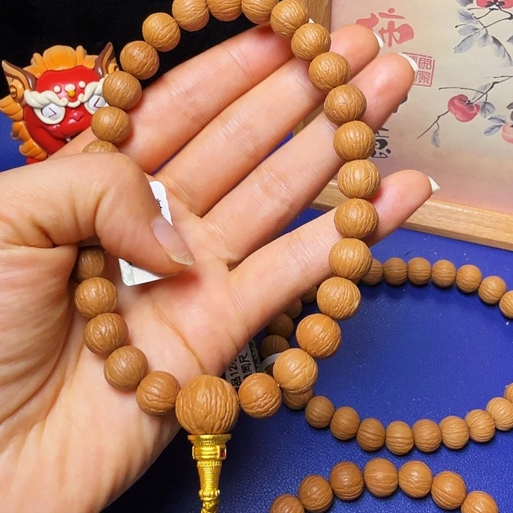 瀟***生猴头核桃吊坠凤羽