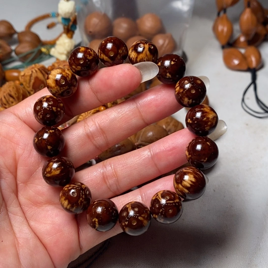 用***8橄榄核吊坠紫金鼠光珠