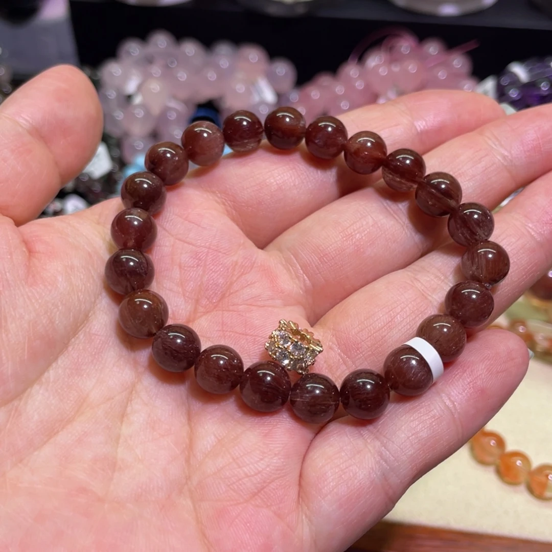 莳***念未镶嵌手链水晶红发