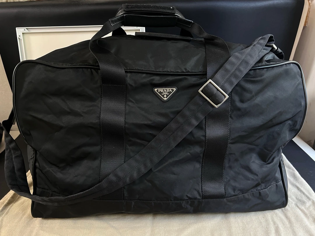 95新 Prada/普拉达  0 黑色55尺寸黑银旅行袋手提斜挎包