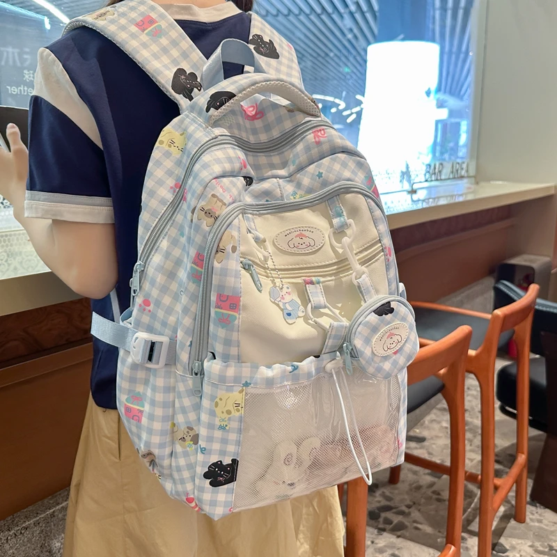 2025新款可爱书包女初中生小学生三到六年级轻便减负护脊双肩背包