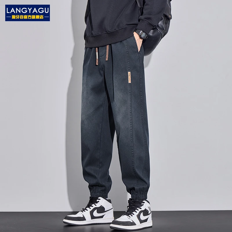 高端秋季新款牛仔裤男士潮牌宽松束脚百搭运动外穿水洗长裤子男