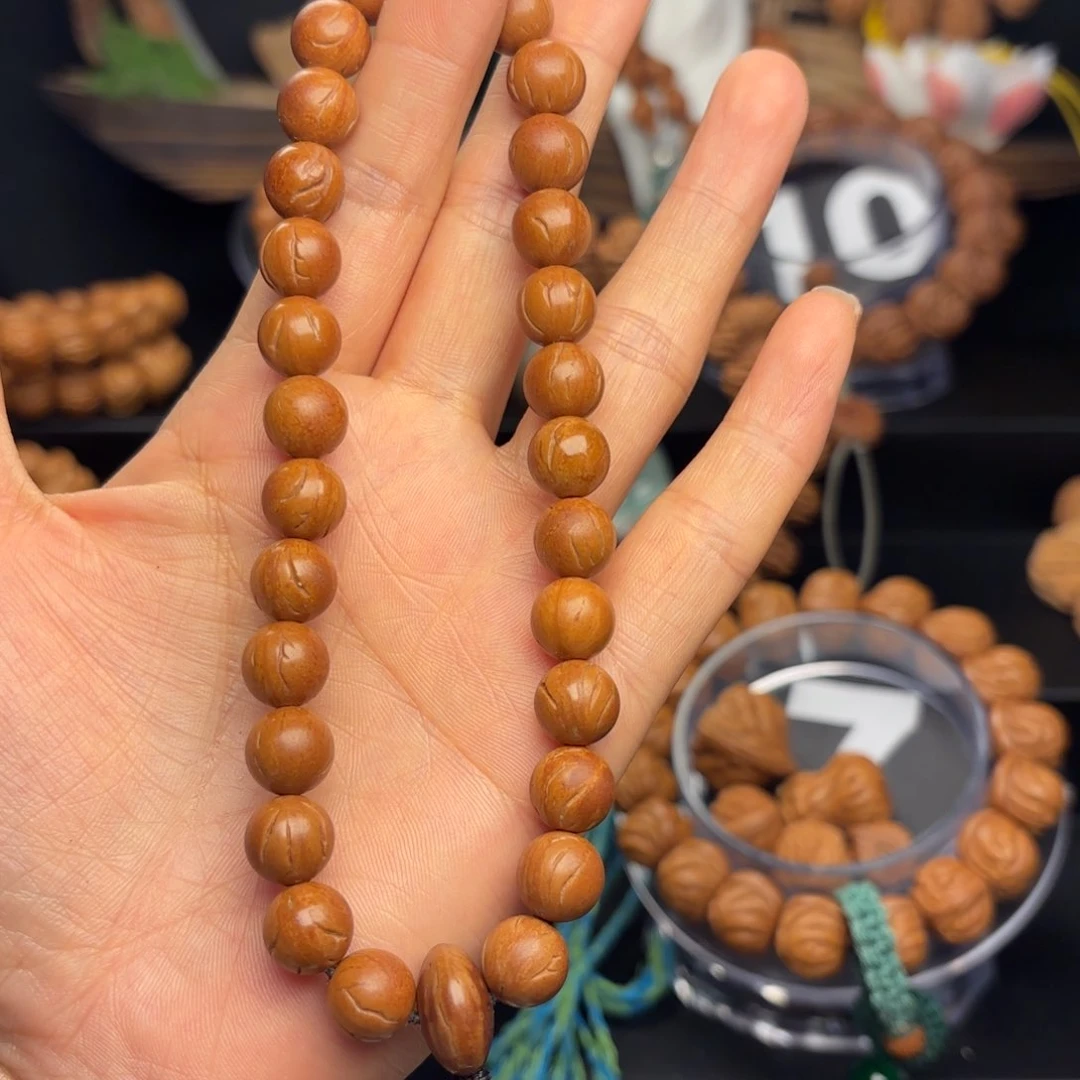 桃核吊坠知**乐野生玉龙里光珠0.97