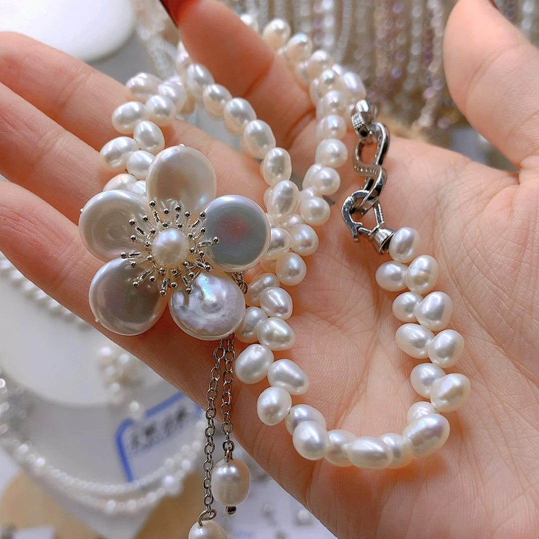 银S925镶嵌淡水珍珠耳饰花****缘