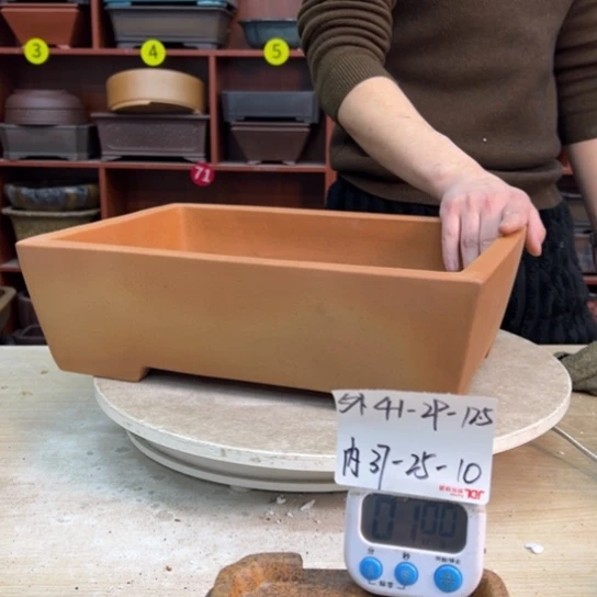 赵***紫砂花盆里都藏的什么