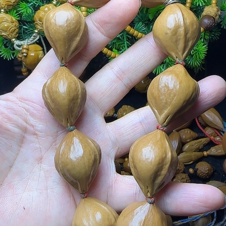 橄榄核雕刻素手串