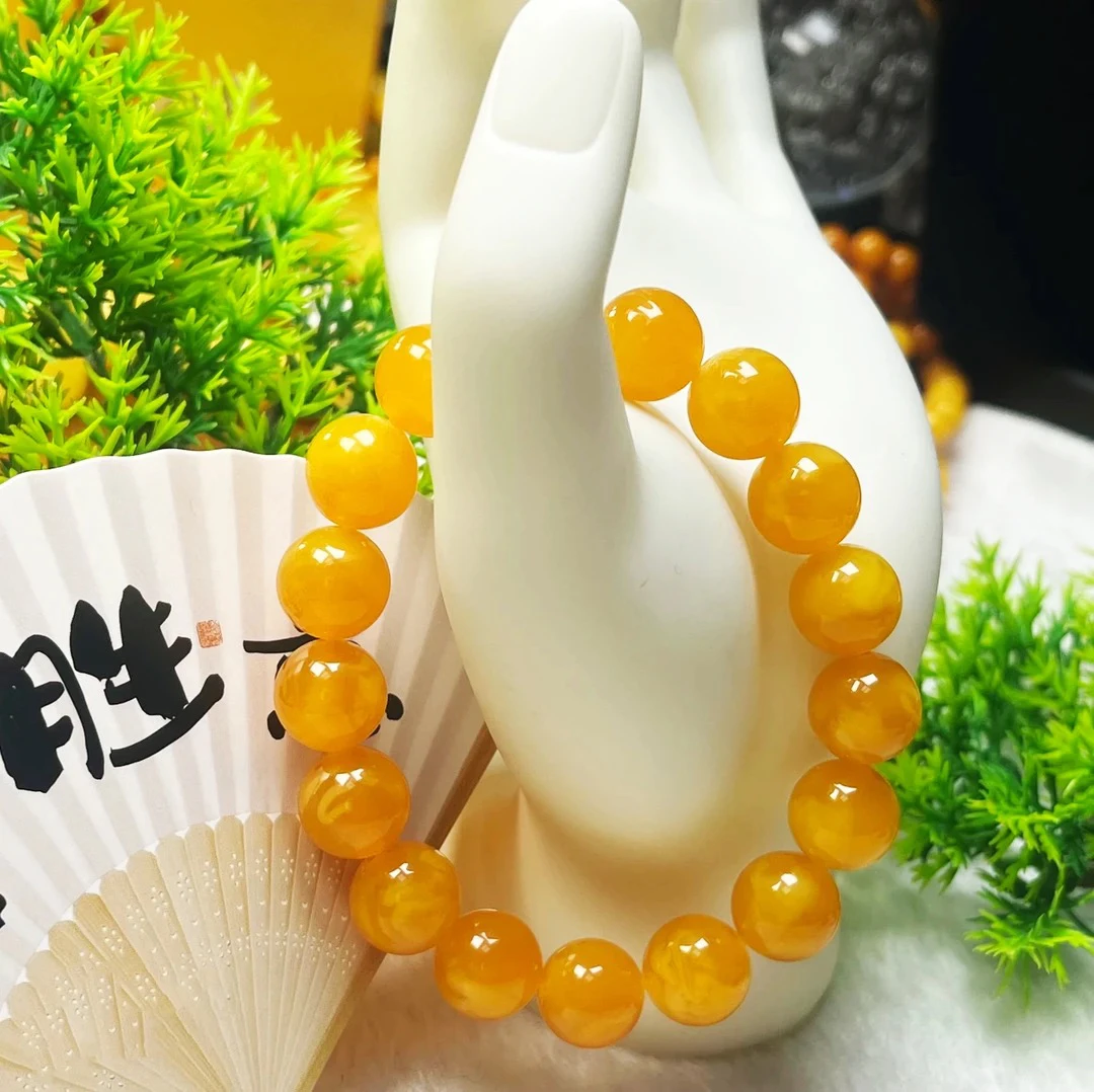 w137古巴新蜜 蜜糖红手串飘花12mm