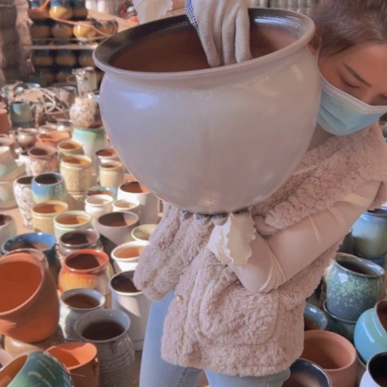 紫砂花盆高24口30。   9