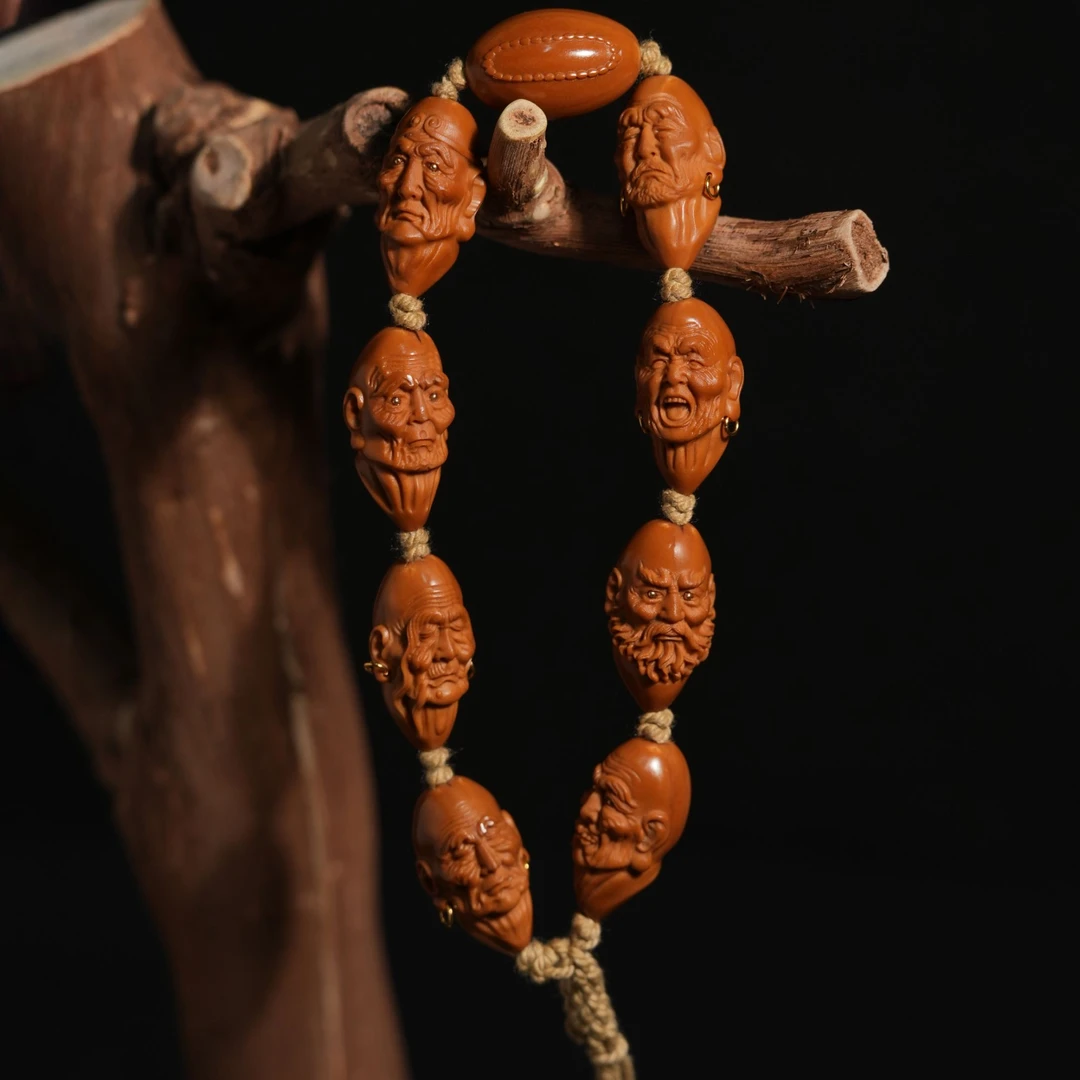 瑾亜，八圣罗汉橄榄核雕手持3