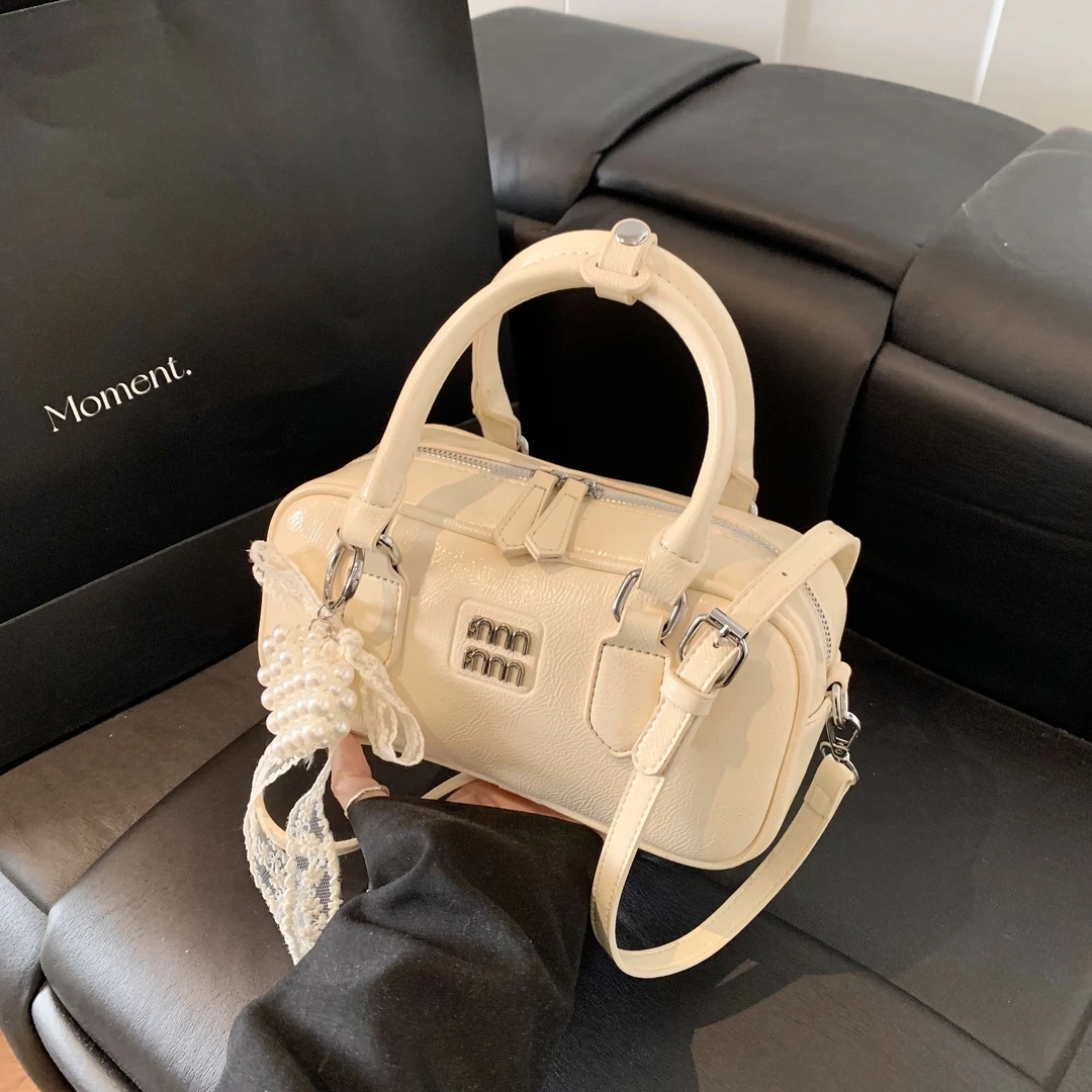 YUSMYU爆款手提保龄球包包女2025春夏新款气质百搭上班通勤斜挎包