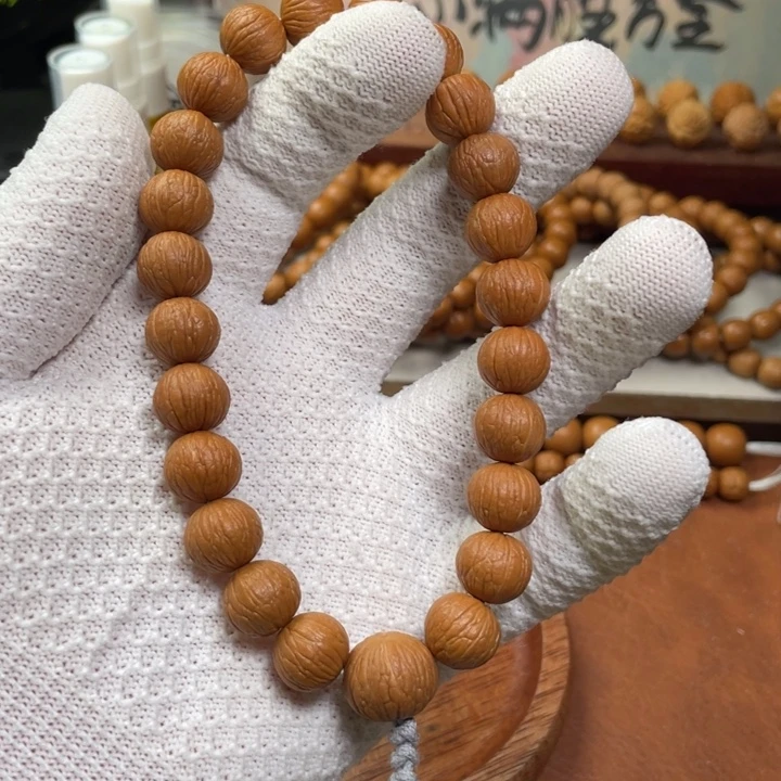 唯***博猴头核桃手串凤羽