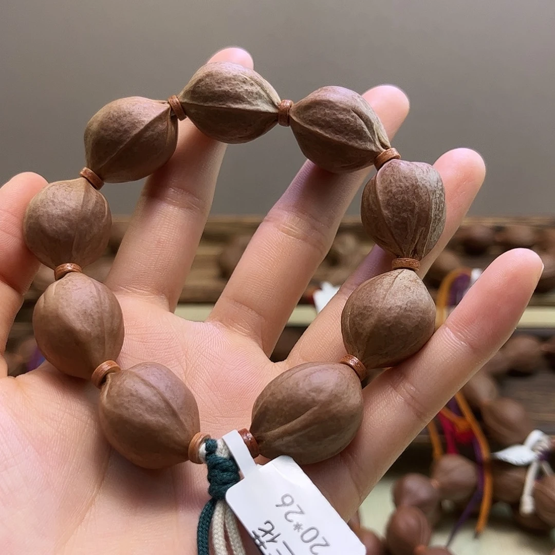 娜***爱吊坠橄榄核111111