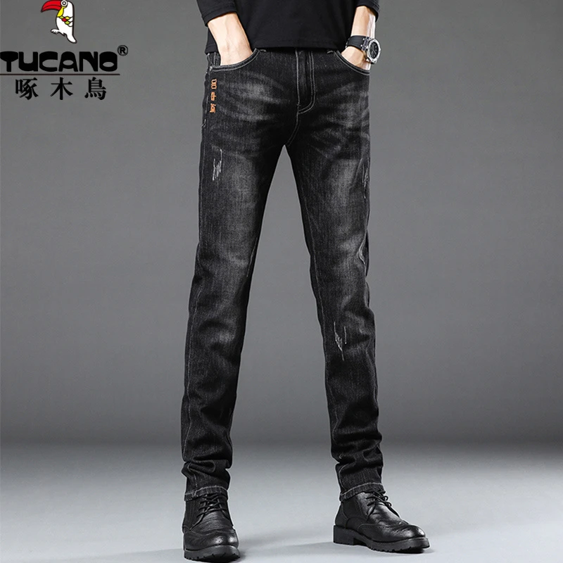 啄木鸟春秋牛仔裤男士韩版修身小脚2025新款潮牌百搭黑色休闲裤子