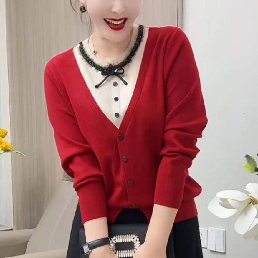 春季新款时尚休闲圆领竖扣假两件拼色针织衫女长袖毛衣上衣