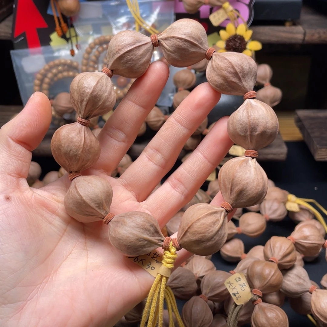 卢***橄榄核吊坠2630四花铁核