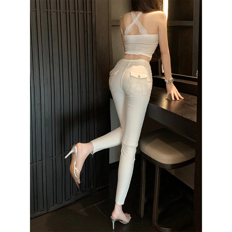 白色蝴蝶结小脚牛仔裤女2025年秋季新款高腰弹力修身显瘦美臀长裤