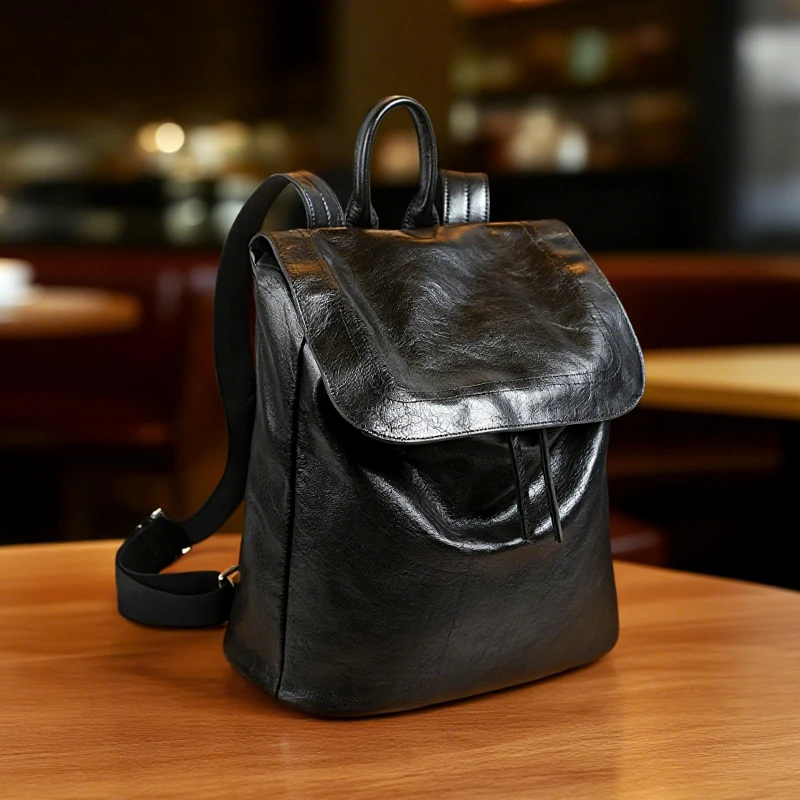 [冰语]春夏百搭新款简约大容量户外旅行黑色牛皮双肩包-250425