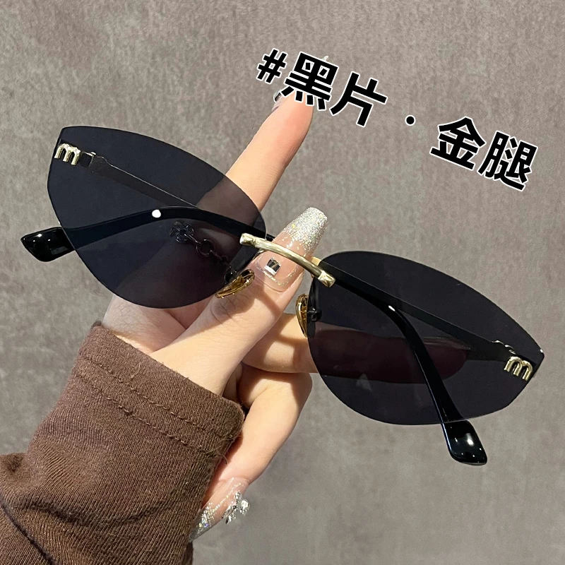 2025年新款欧美时尚猫眼无边框太阳镜千禧辣妹风大脸显瘦百搭墨镜