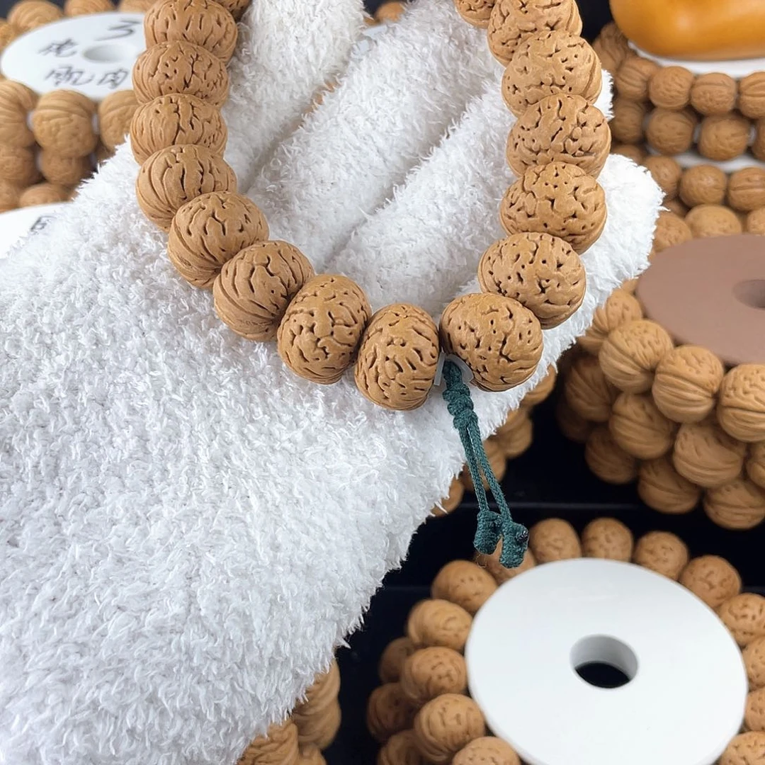 桃核吊坠树王纽扣手持