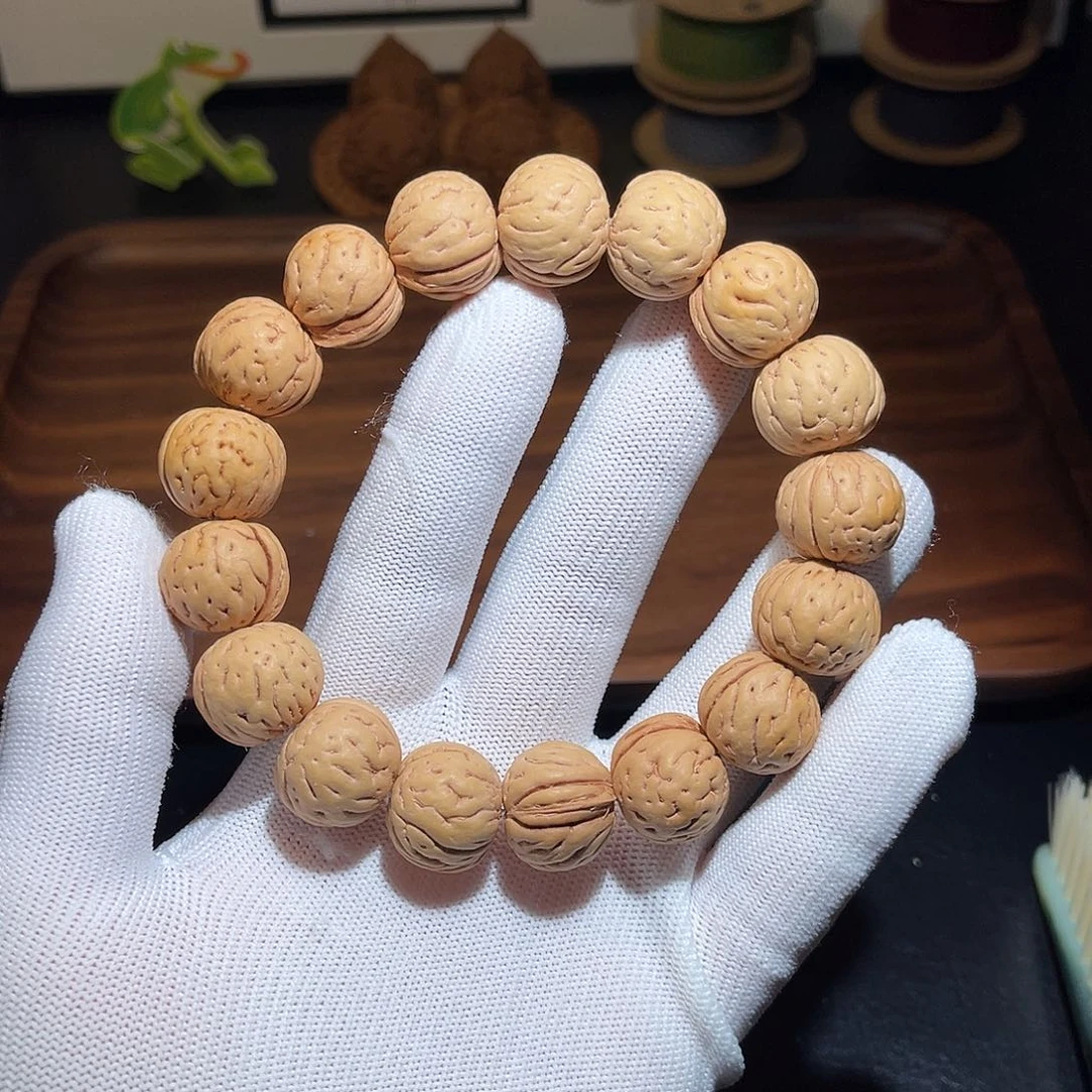 小***明桃核手串原皮色水晶肌肉