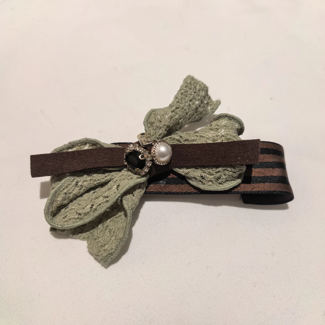 E919绿色蝴蝶结闪闪条纹边夹