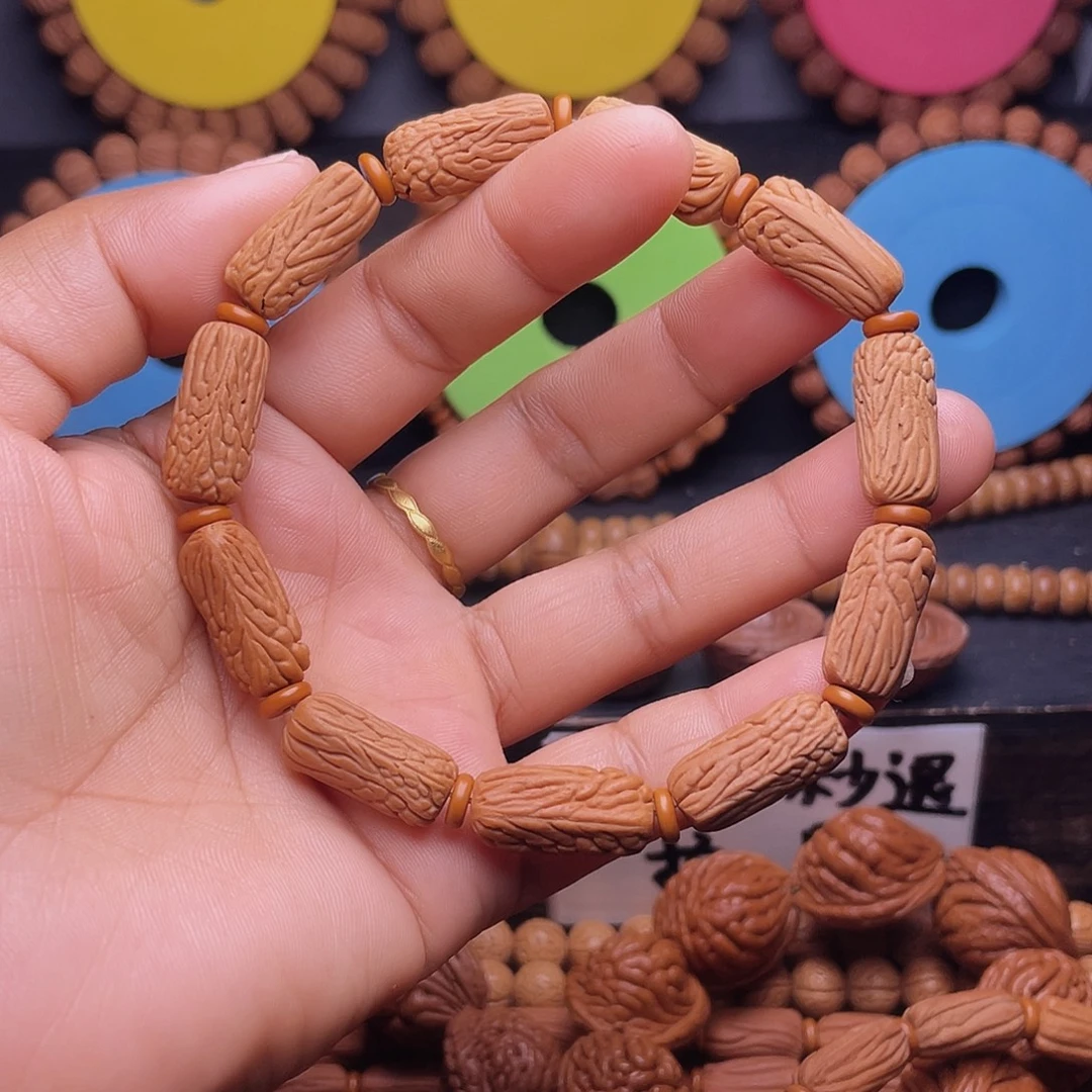 光***头桃核手串秦岭龙纹桃核金条