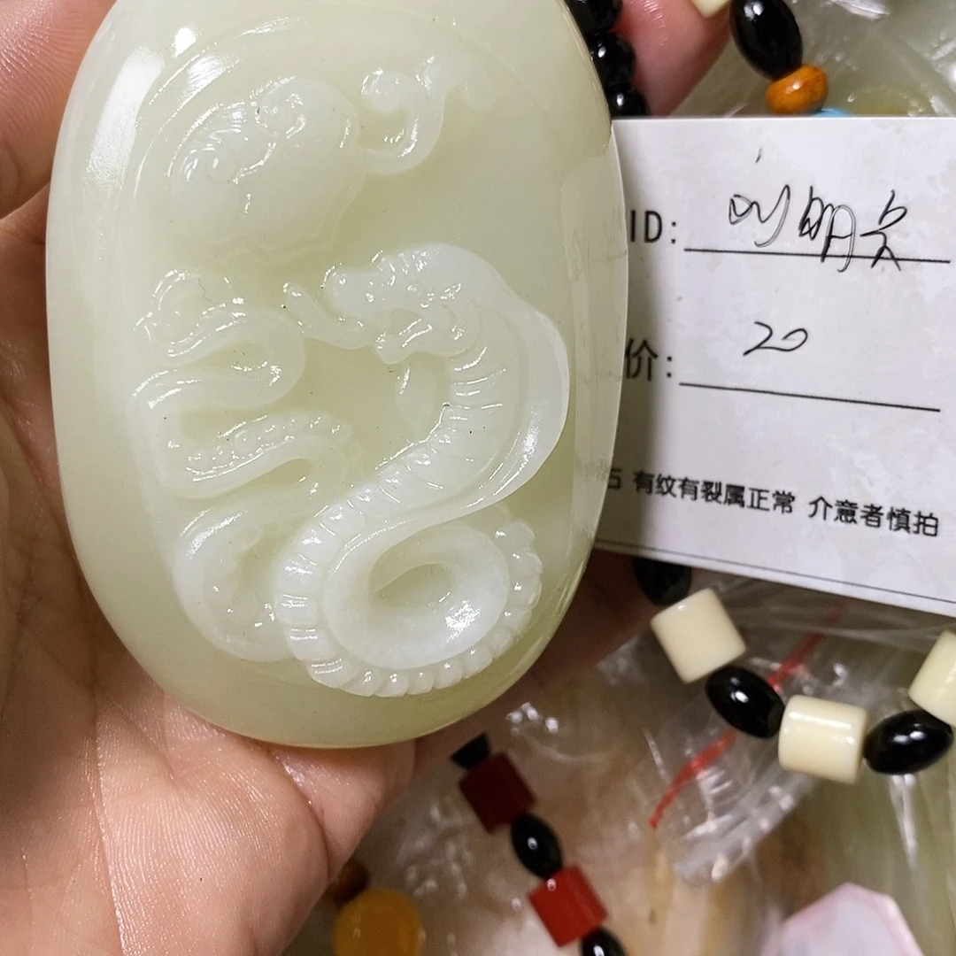 石材刘*兵古青石手把件