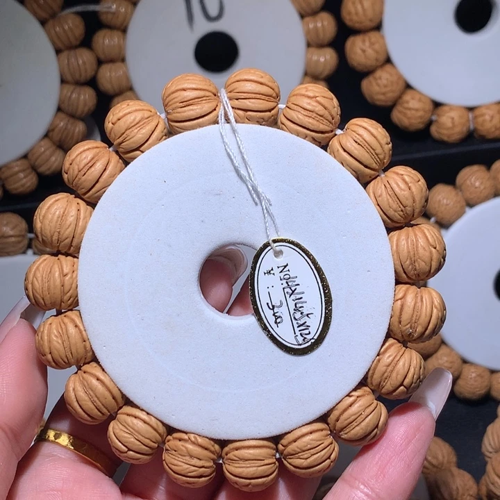 ×***×桃核手串馒头脐金丹