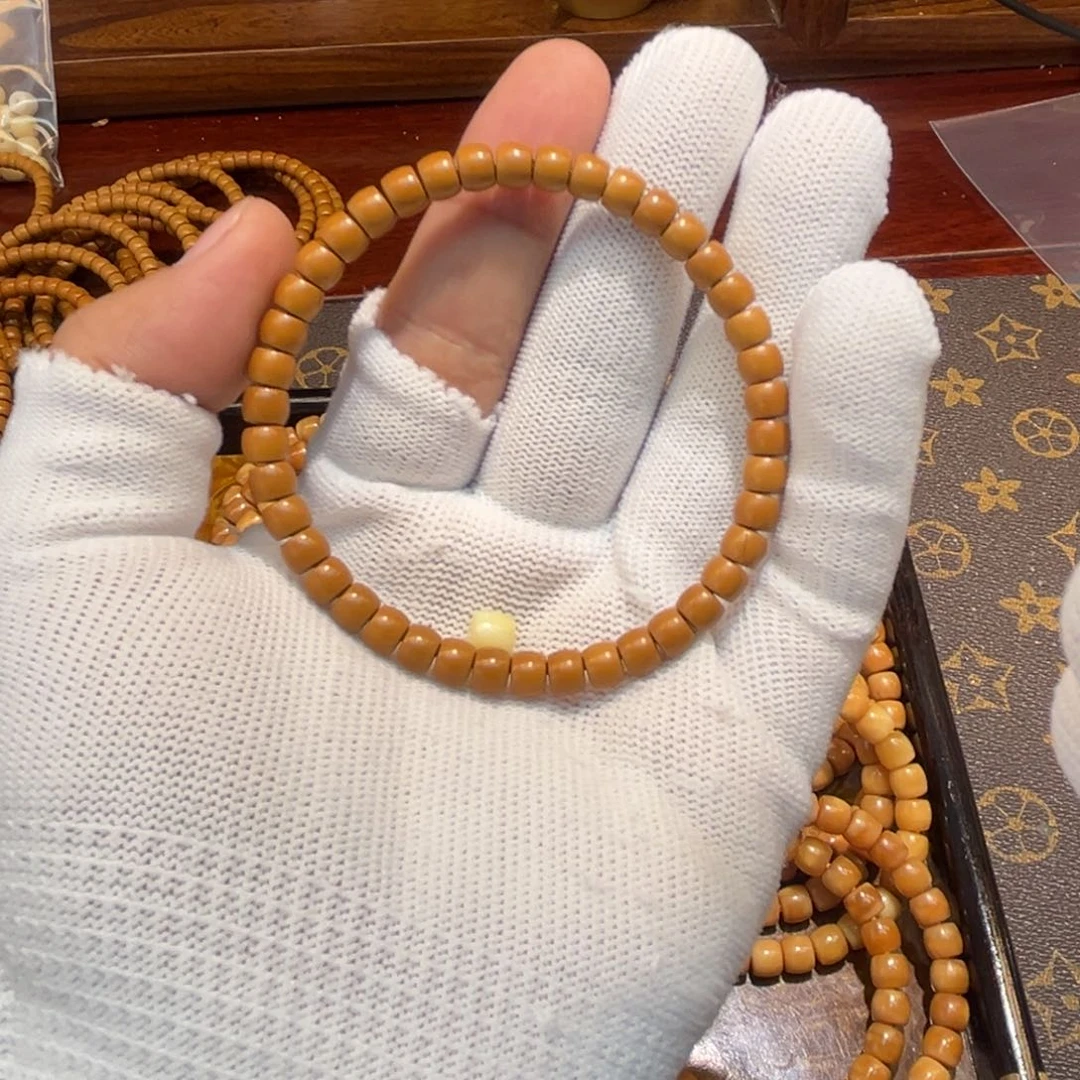 橄榄核吊坠桐*万0.56核尖手串