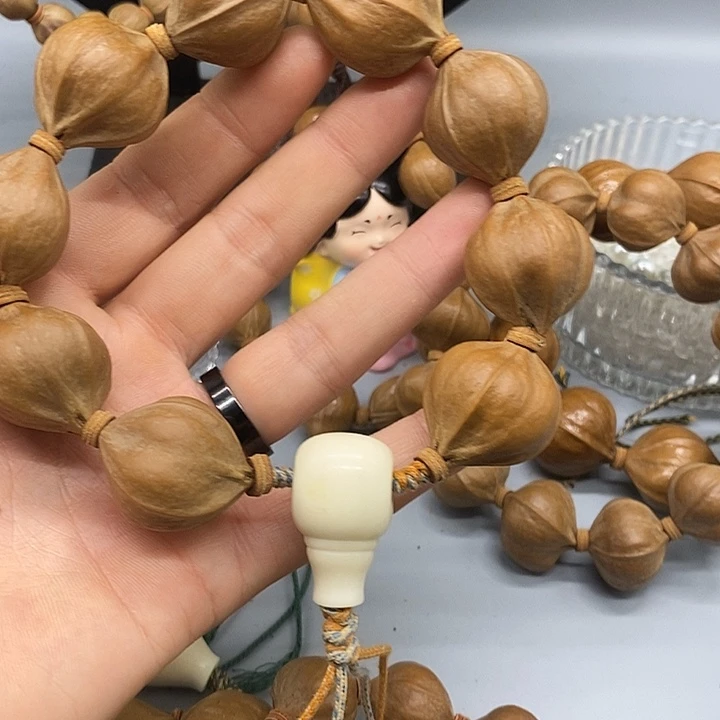 靳***卫橄榄核手串/手链2526铁四花