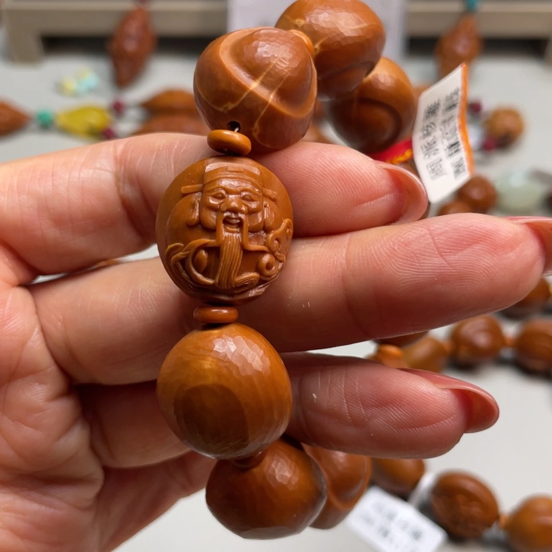 橄榄核手串兜***?橄榄核雕工艺