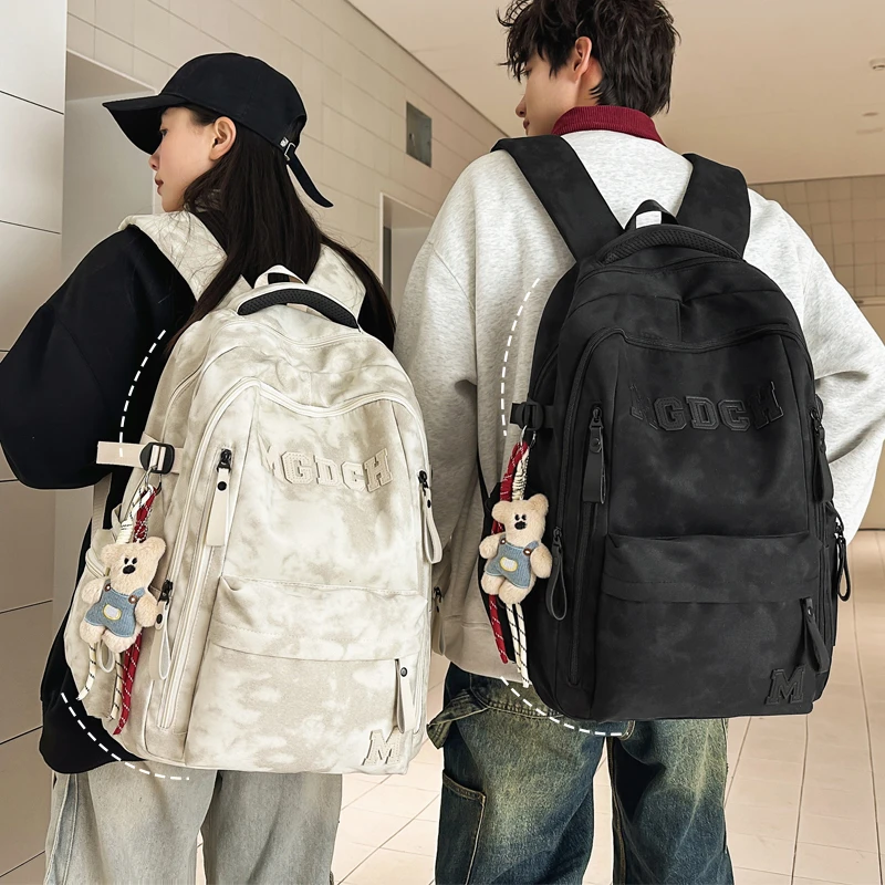 减负护脊书包初中生中学生高中生背包男大容量轻便防水旅游双肩包