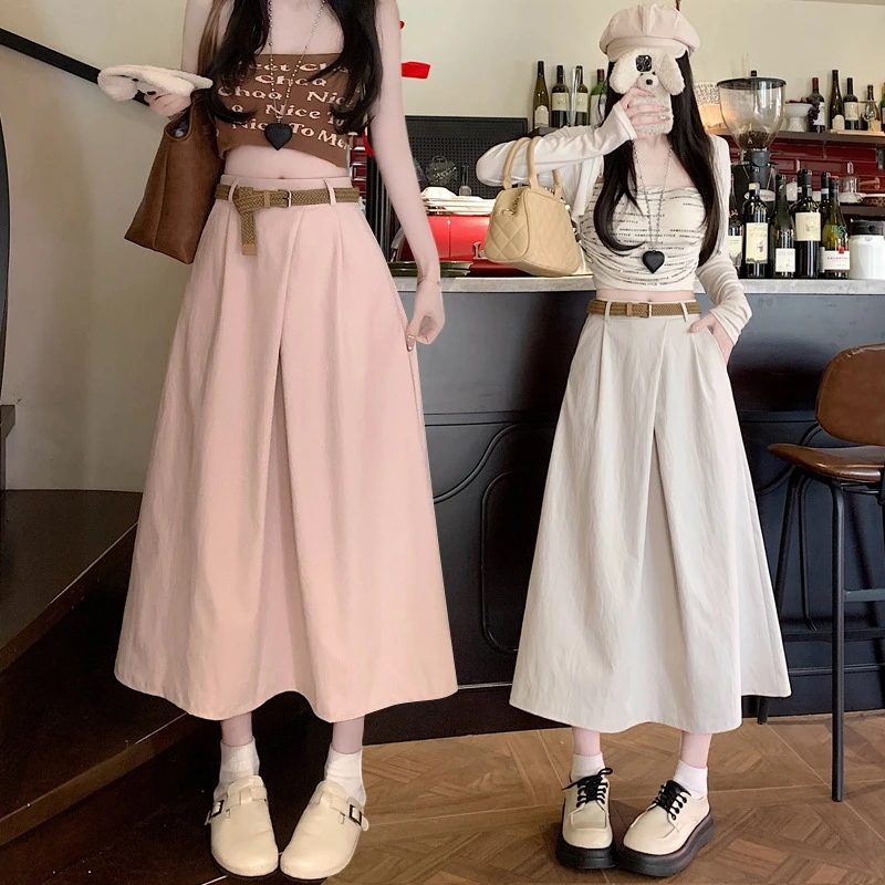 韩系高腰遮胯显瘦交叉a字口袋半身裙女2025春夏新款减龄中长裙子