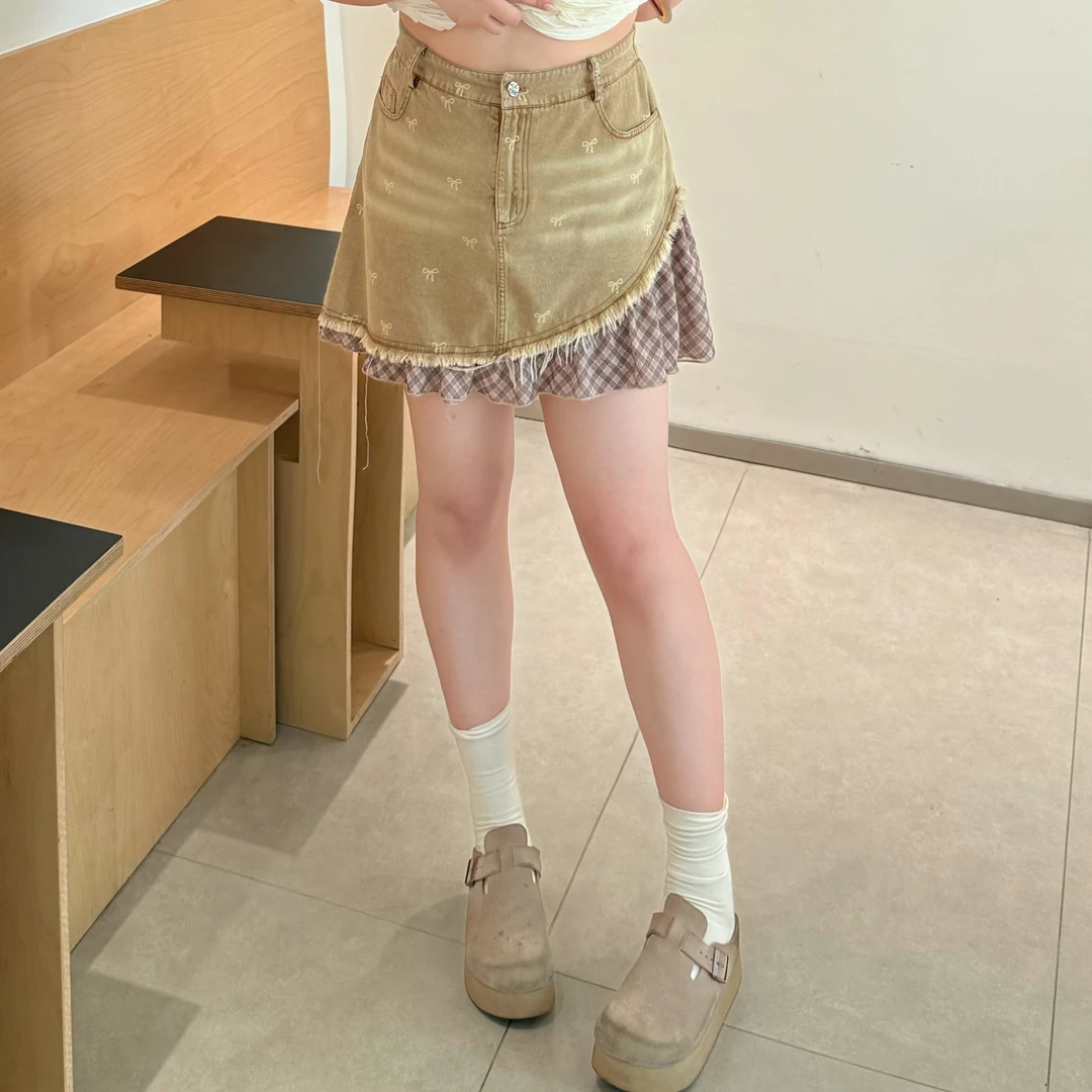 维维&南岛风特大码2025遮肚子藏肉显瘦a字蝴蝶结拼接半身裙ZWW719