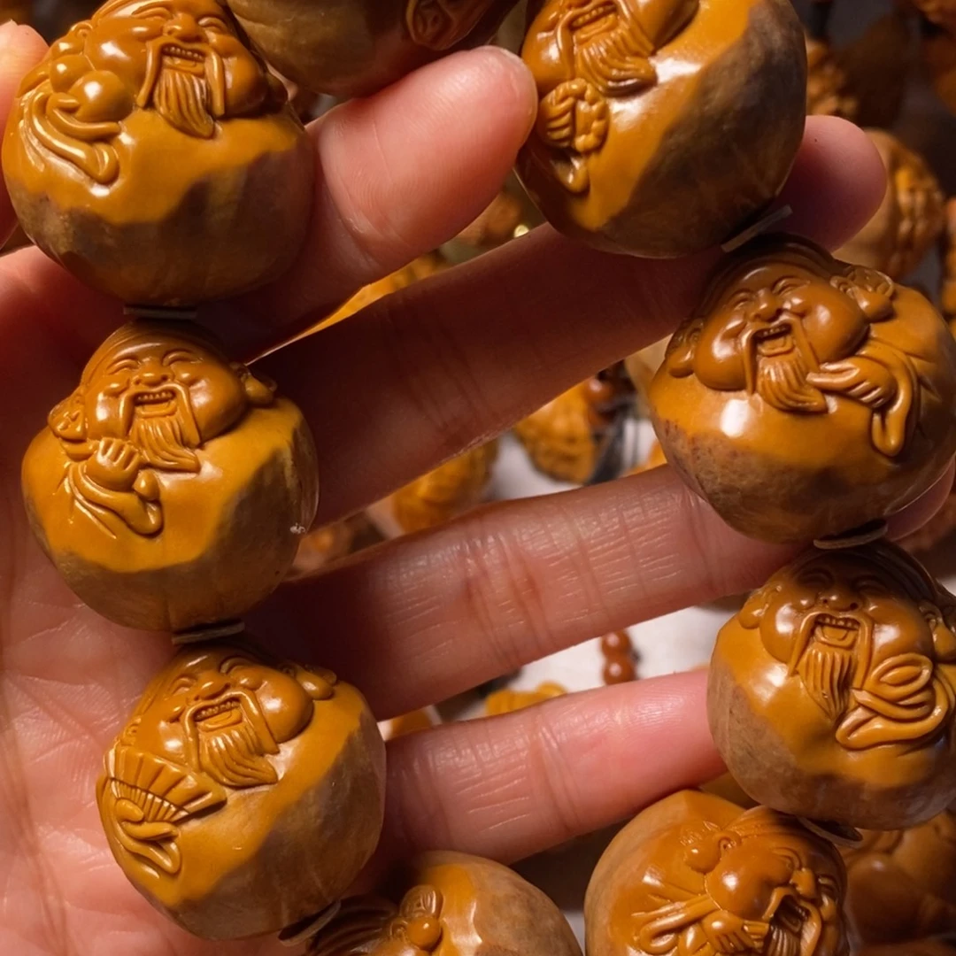 顺***然手串/手链橄榄核包衣大财神精品