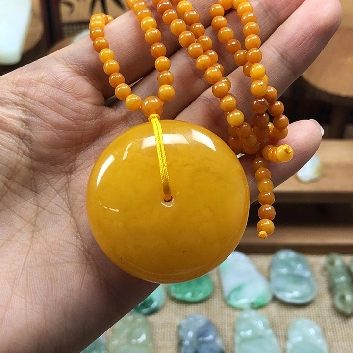 琥珀未镶嵌颈饰蜜蜡平安扣（34.5g）